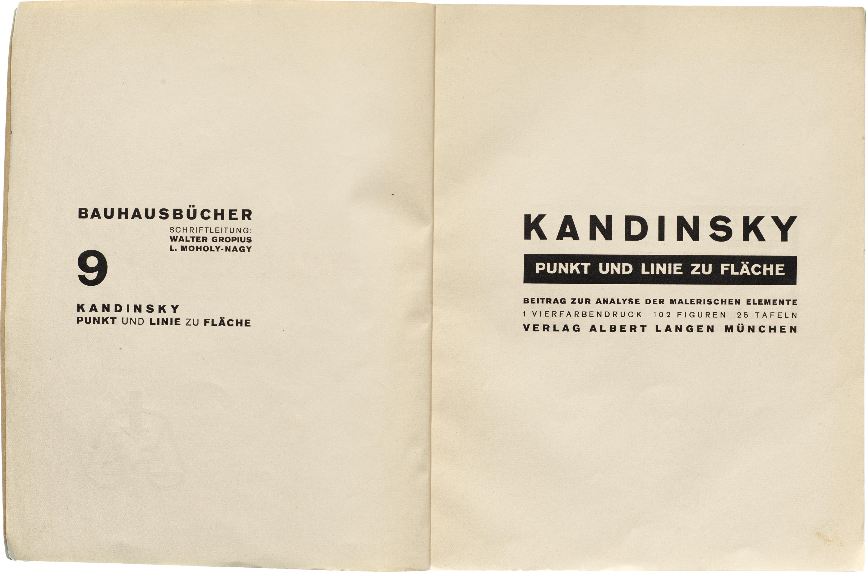 Open pages of book with black text on paper